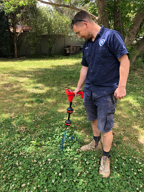 Fix-It Right plumber using a locator for leak detection
