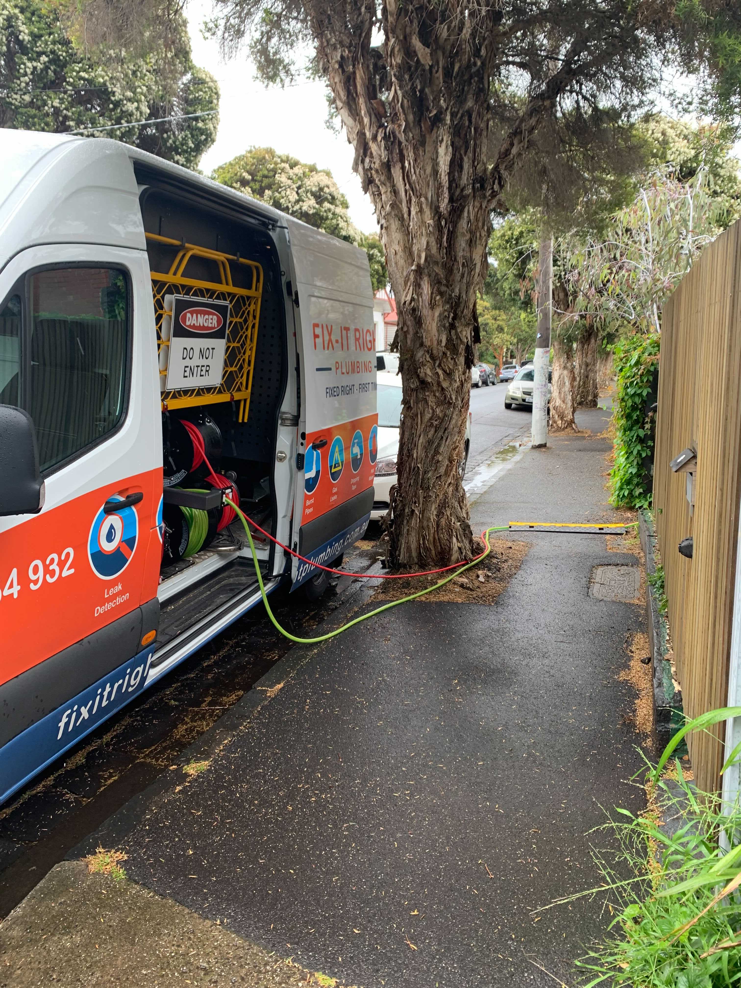 Fix-It Right van with jetter heading out to a job