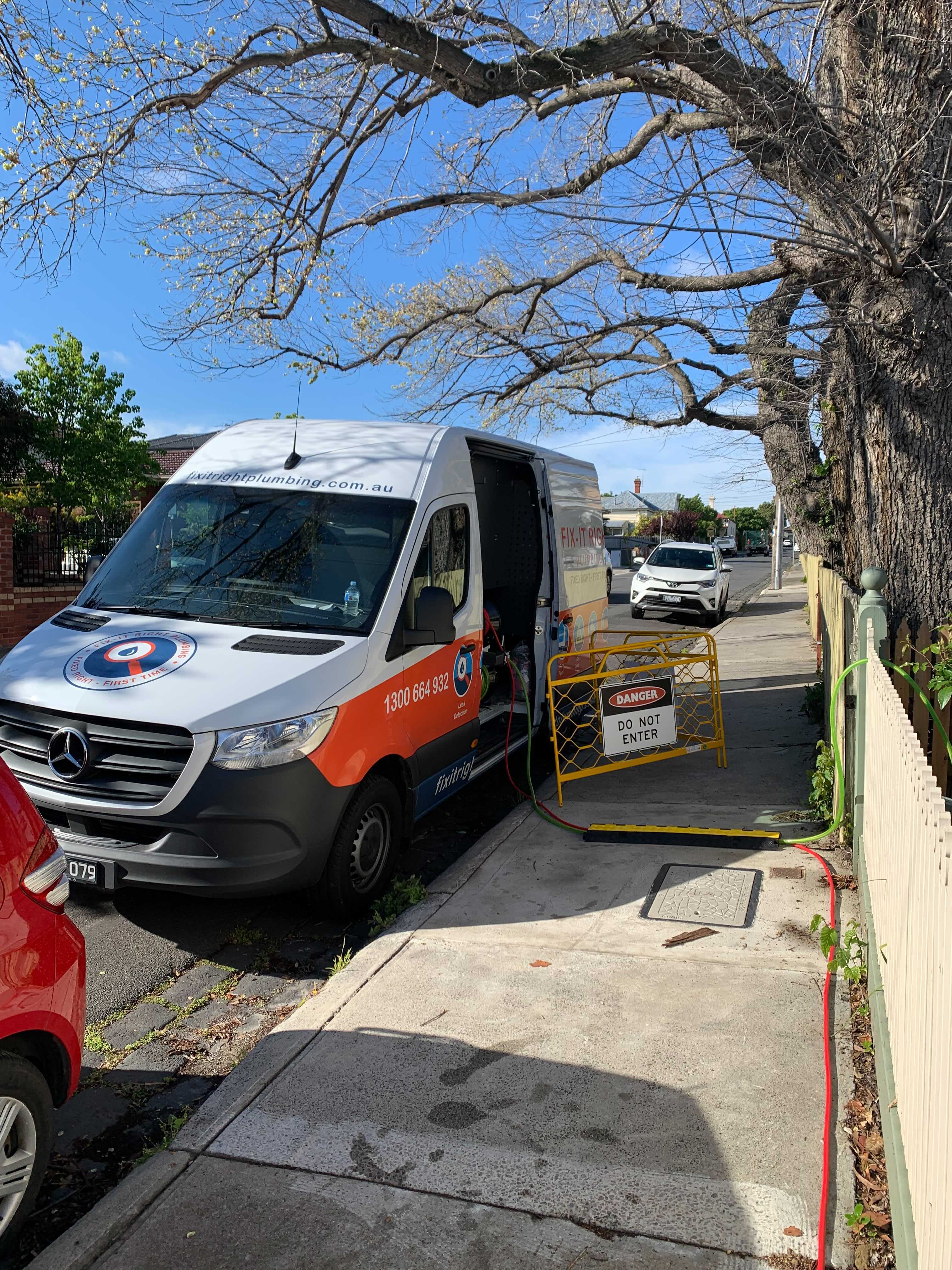 Fix-It Right van set up at a residential job site